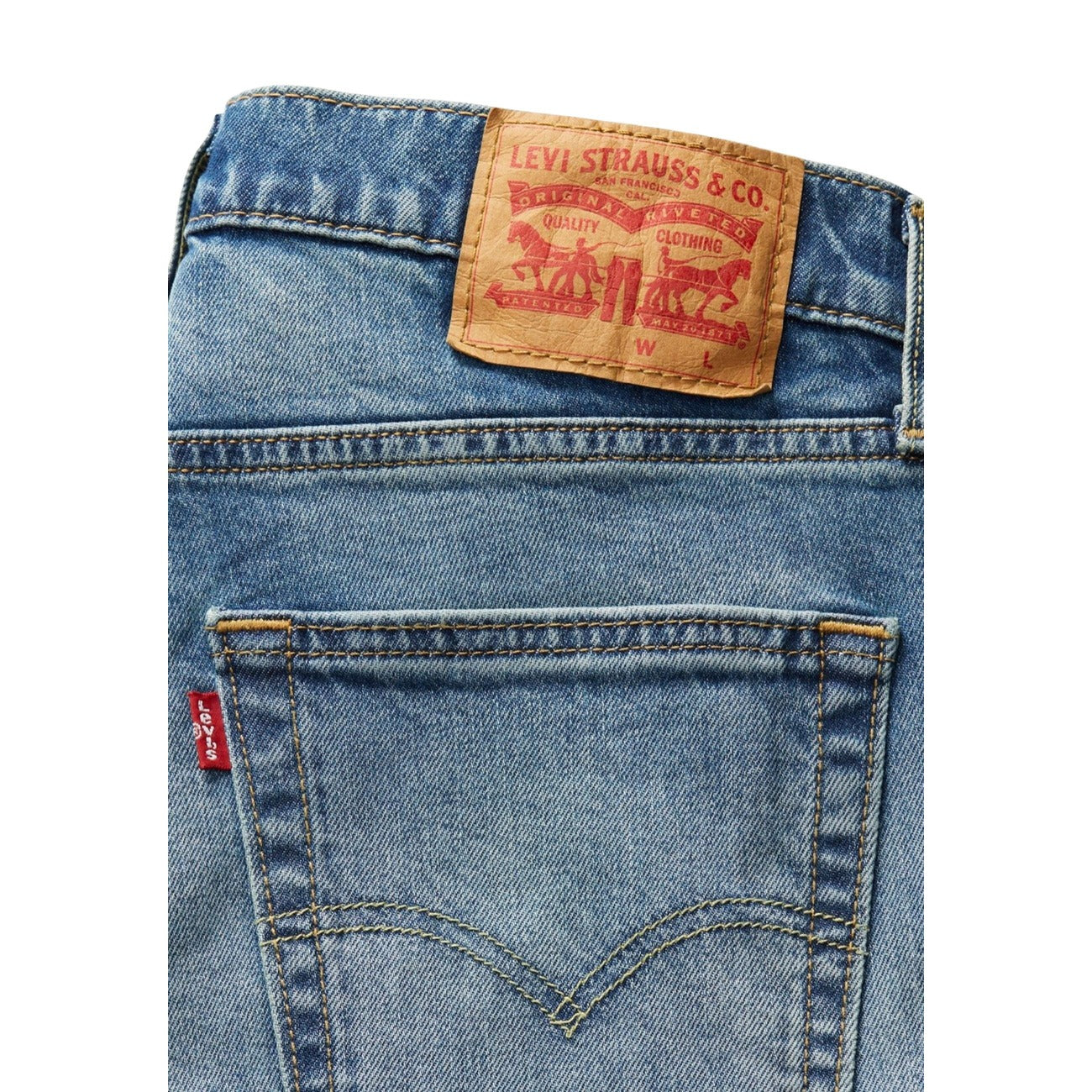 Close-up of Levi's jeans with a brand label on a white background