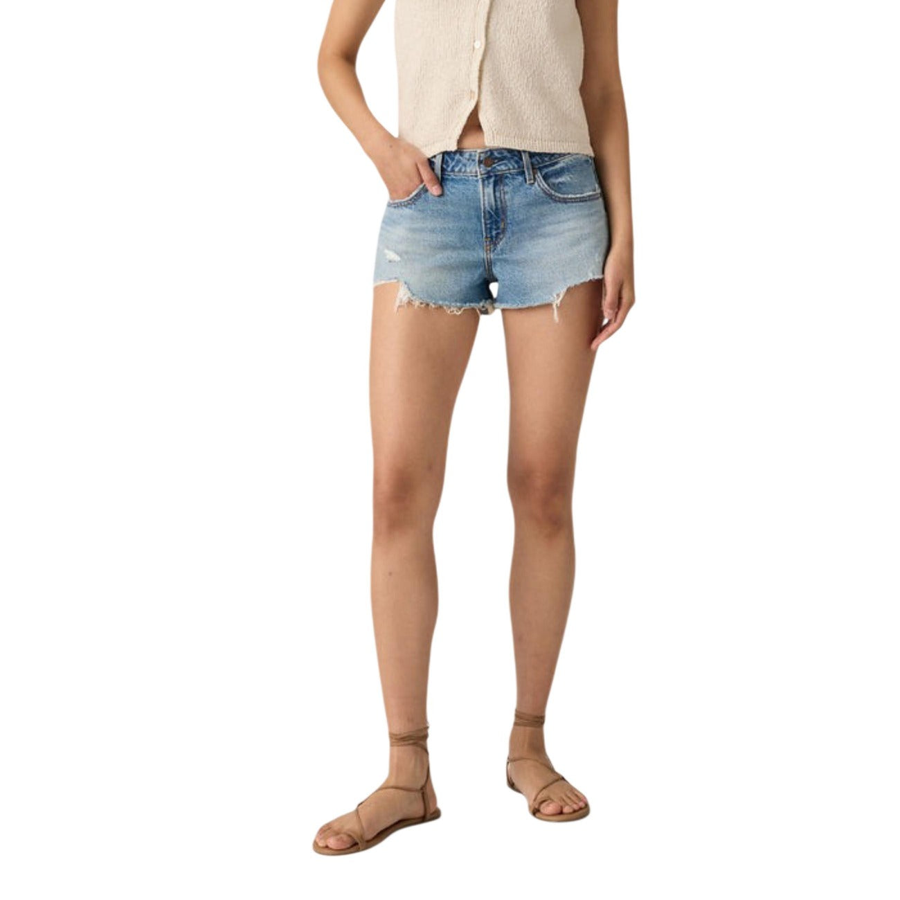 Person wearing light blue denim shorts on a white background